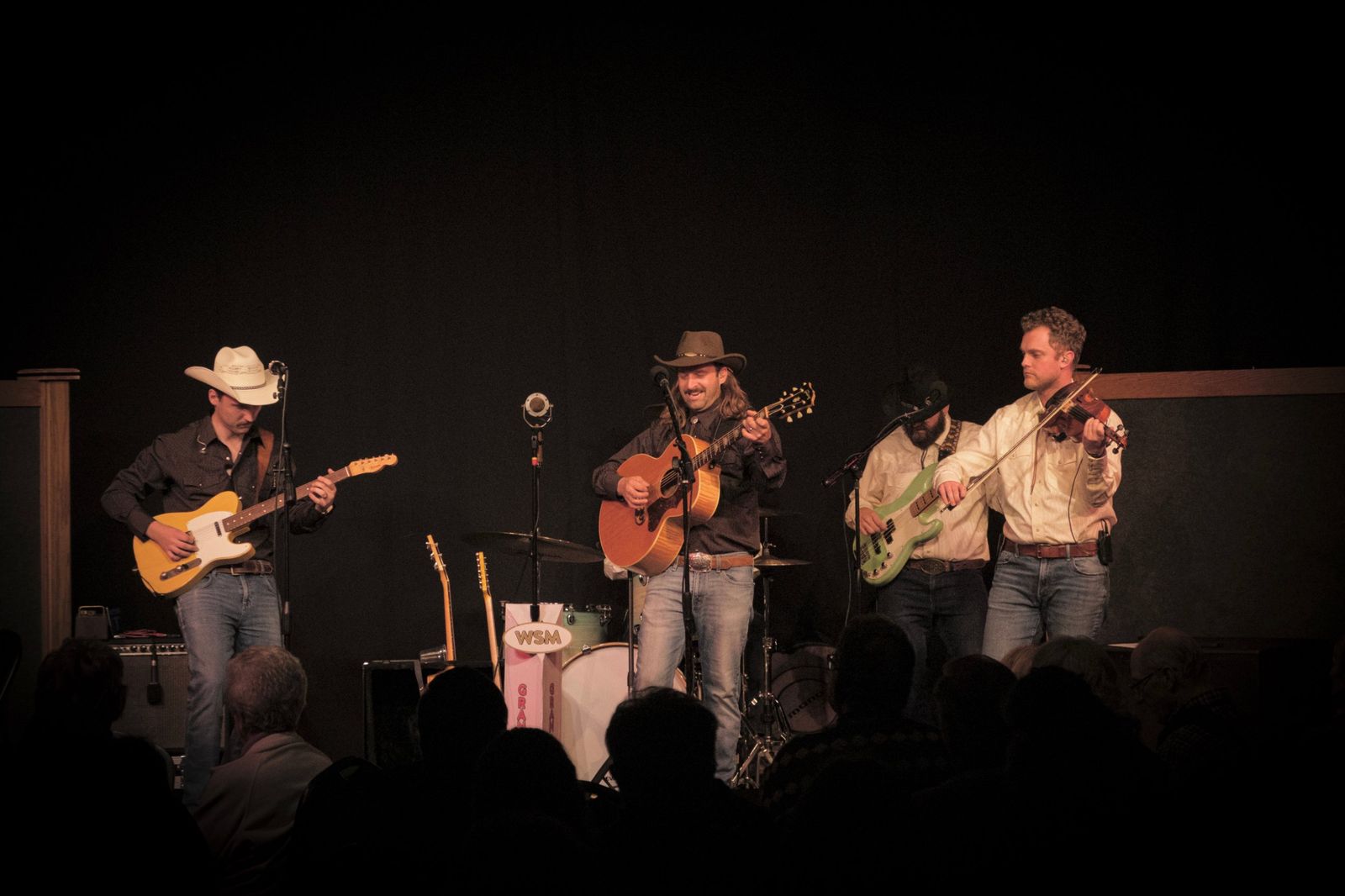 The Rat River Boys playing on stage